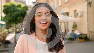 Close up portrait amazed excited happy Indian Arabian ethnic woman lady female businesswoman smiling laughing applauding