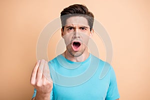 Close-up portrait of angry annoyed guy claiming pretense to you bad mood isolated over beige pastel color background
