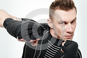 Close up portrait of an angry professional male fighter boxing