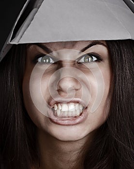 Close-up portrait of an angry woman screaming in anger. The concept of strong emotions. toned image.