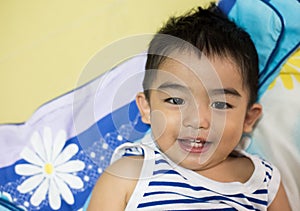 Close up portrait of Asian boy, Smiling action.