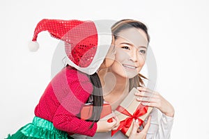 Close up portrait of Asian little toddler girl surprise her mother with gift box