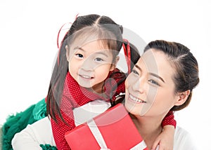 Close up portrait of Asian little toddler girl surprise her mother with gift box