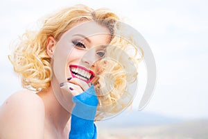 Close up portrait of attractive caucasian smiling woman blond isolated on white. Red Lips, toothy smile face. Head and