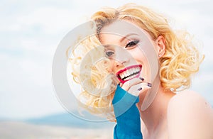 Close up portrait of attractive caucasian smiling woman blond isolated on white. Red Lips, toothy smile face. Head and