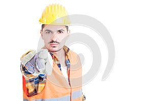 Close up portrait of attractive engineer pointing at you