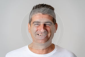 Close up portrait of an attractive middle aged man having fun and looking happy joyful smiling and laughing at the camera in human