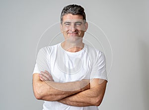 Close up portrait of an attractive middle aged man having fun and looking happy joyful smiling and laughing at the camera in human