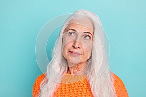 Close-up portrait of attractive minded long-haired woman overthinking copy empty space isolated over teal bright color