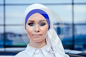 Close-up portrait attractive and mysterious Muslim European woman perfect skin and charming eye makeup the head is photo