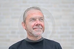 Close up portrait of an attractive serious man looking to side