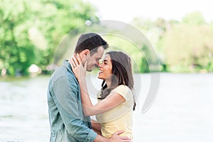 Close up portrait of attractive young couple in love outdoors.