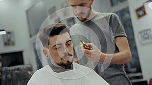 Close-Up Portrait Of Attractive Young Man Getting Trendy Haircut.