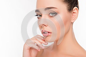 Close up portrait of attrective beautiful woman touching her chin