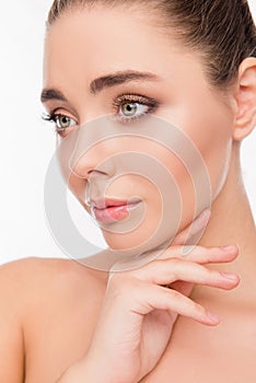 Close up portrait of attrective beautiful woman touching her chin