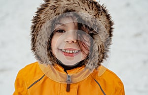 Close-up portrait of baby girl in winter outdoors