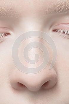 Close up portrait of beautiful albino woman isolated on studio background. Beauty, fashion, skincare, cosmetics concept