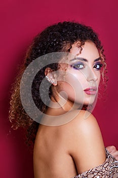 Close-up portrait of a beautiful young african american female fashion model with curly hair