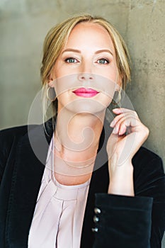 Close up portrait of beautiful blond woman with blue eyes