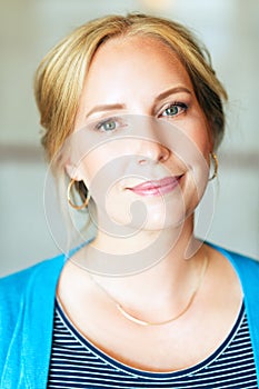 Close up portrait of beautiful blond woman with blue eyes