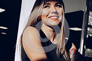 Close up portrait of a beautiful blonde woman with long hair smiling