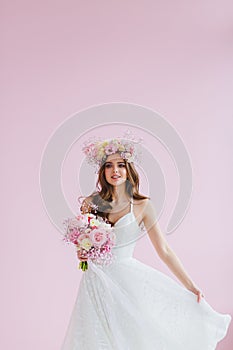 Close-up portrait of beautiful bride with flower wreath on her head