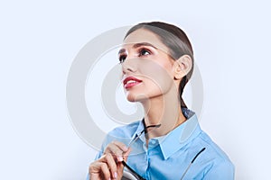 Close-up portrait of a beautiful Businesswoman with glassesl looking up photo