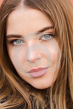 Close-up portrait of a beautiful fair-skinned girl, natural light