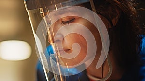 Close Up Portrait of Beautiful Female Fabricator in Safety Mask. She is Grinding a Metal Object. E