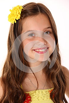 Close-up portrait of a beautiful happy young teenage girl with chic long hair