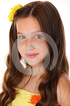 Close-up portrait of a beautiful happy young teenage girl with chic long hair