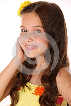 Close-up portrait of a beautiful happy young teenage girl with chic long hair
