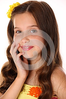 Close-up portrait of a beautiful happy young teenage girl with chic long hair