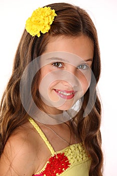 Close-up portrait of a beautiful happy young teenage girl with chic long hair