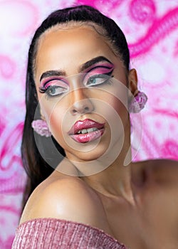 Close-up portrait of beautiful latin woman with pink makeup