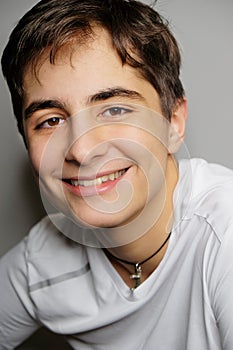 Close-up portrait of beautiful laughing young man