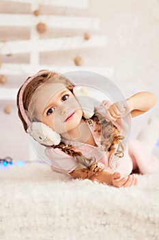 Close up portrait of beautiful little girl in earmuffs