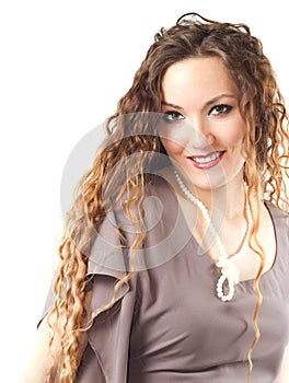 Close up of portrait of beautiful model woman with curly long hair on white background.