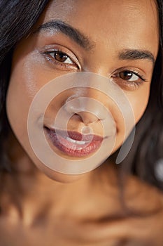 Close up portrait of beautiful multiethnic girl looking at camera