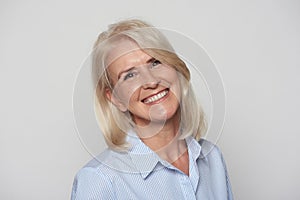 Close up portrait of beautiful older woman smiling isolated