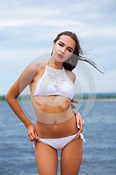 Close up portrait beautiful sexy brunette woman in white bikini