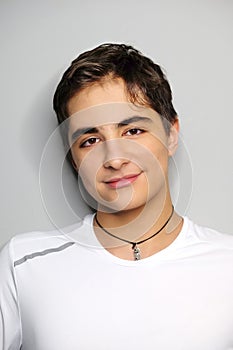 Close-up portrait of beautiful smiling guy, studio shot