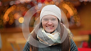 Close-up Portrait of a Beautiful Smiling Young Woman Wearing Warm Clothing. Girl Laughing and Looking at the Camera