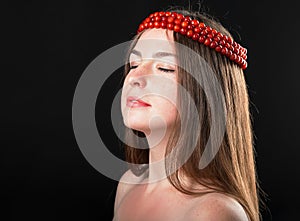 Close-up portrait of beautiful woman in chaplet