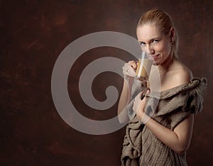 Close-up portrait of a beautiful woman with cup of coffee