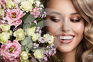 Close up portrait of beautiful woman. Flowers near her face