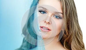 Close-up portrait of beautiful woman under water splash.