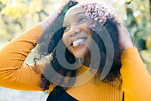 Close up portrait of a beautiful young african american woman smiling and looking up