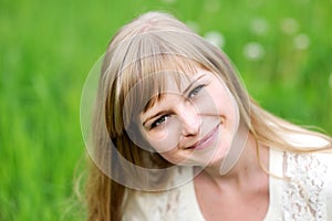 Close-up portrait of beautiful young blond woman