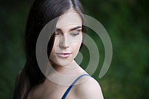 Close-up portrait of a beautiful young caucasian woman with clean skin, long hair and casual makeup